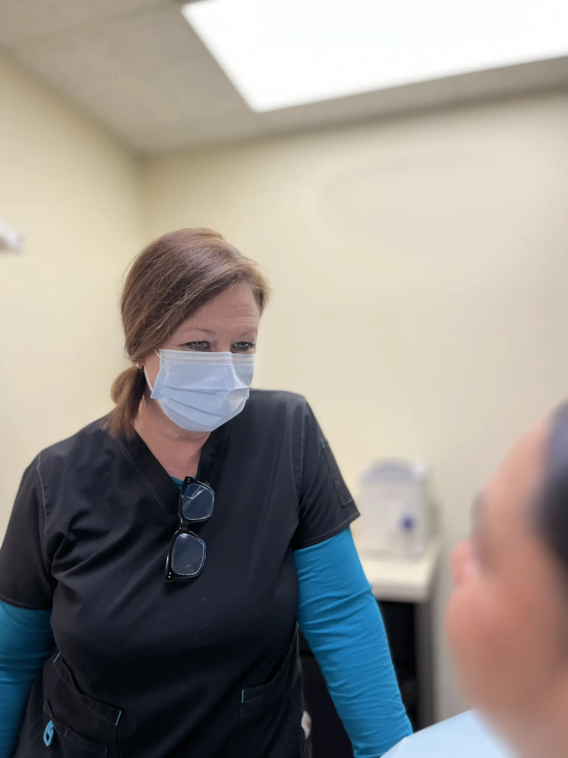 Denturist Lisa Lanham with patient