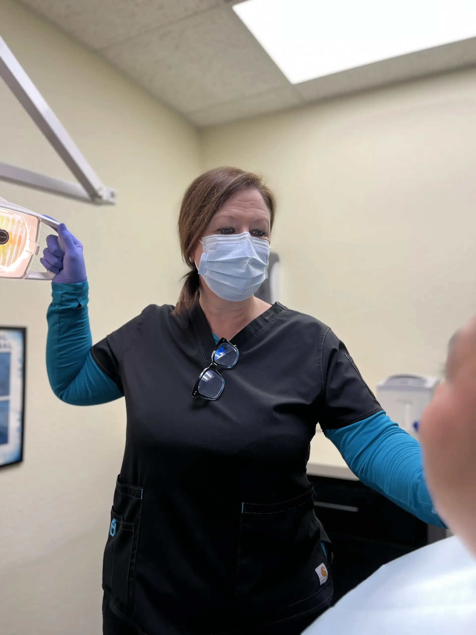 Denturist Lisa Lanham with patient
